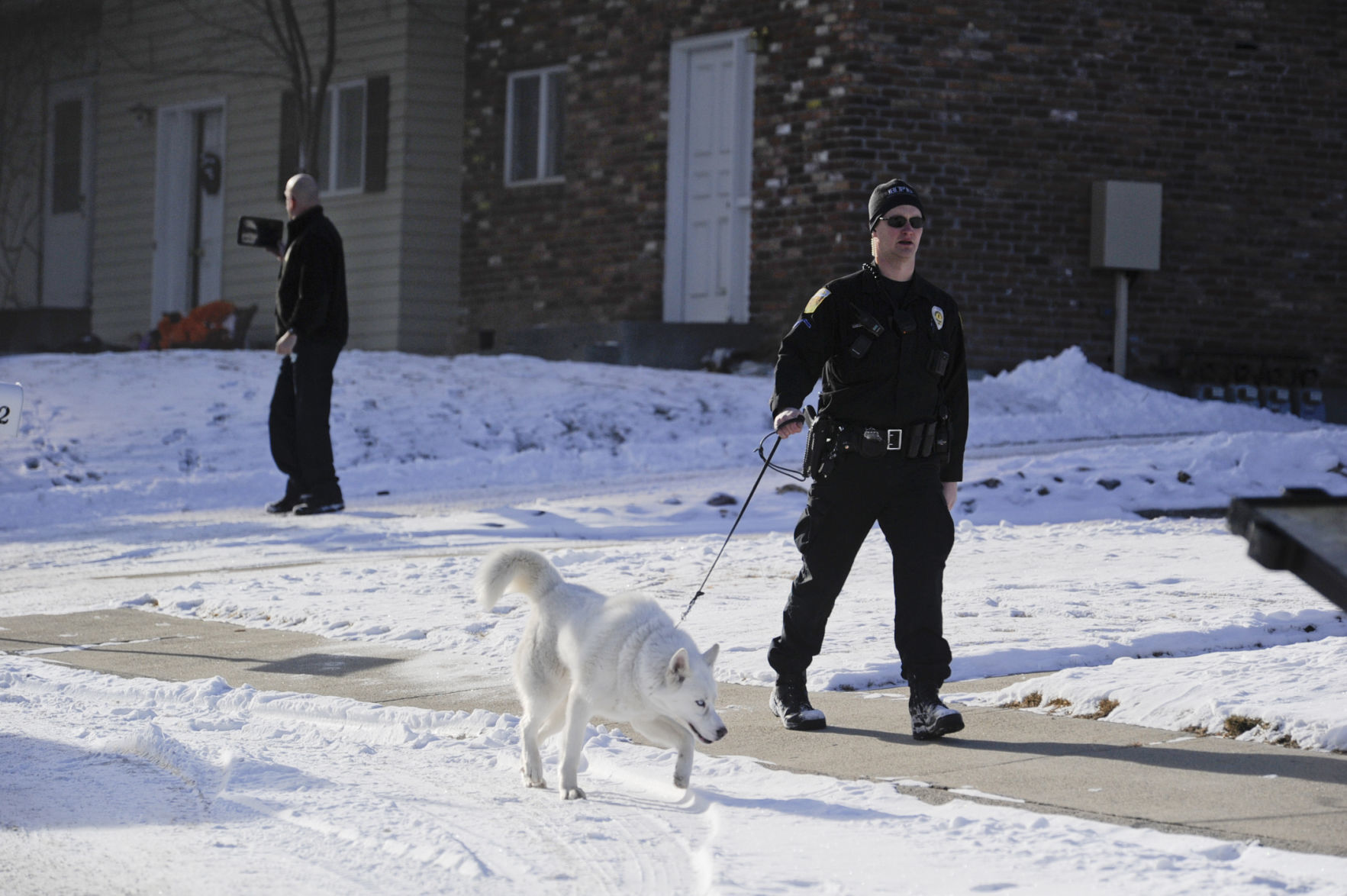 Helena Police Officer John Kaleczyc takes a dog to safety